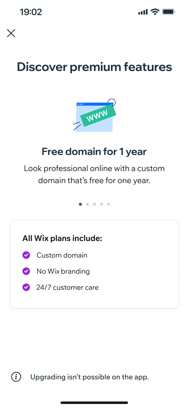 Wix mobile app premium screen titled 'Discover premium features' showing the 'Free domain for 1 year' benefit.